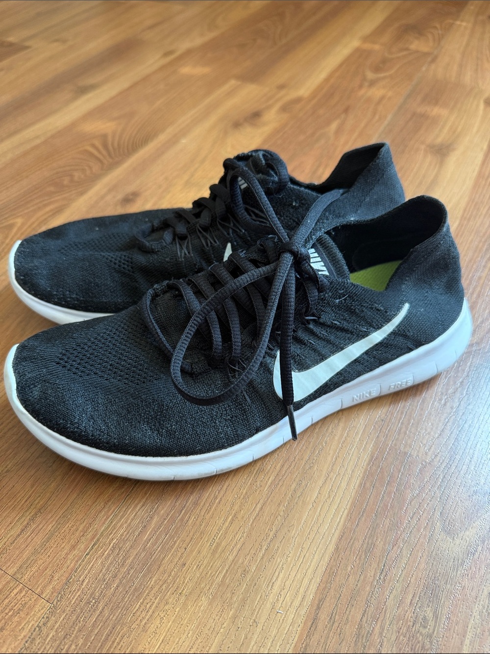 Nike Men's Black Flyknit Running Shoes with White Swoosh and White Sole